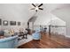 Spacious loft featuring hardwood floors, neutral decor, and comfortable seating arrangement at 15 York Trce, Cartersville, GA 30121