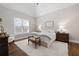Bright main bedroom with hardwood floors, tray ceiling, and comfortable decor at 15 York Trce, Cartersville, GA 30121