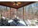 Relaxing covered outdoor patio featuring ceiling fan, heater, and beautiful wooded view at 15 York Trce, Cartersville, GA 30121
