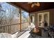 Inviting outdoor patio with a ceiling fan overlooking a serene wooded area at 15 York Trce, Cartersville, GA 30121