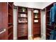 A well-organized walk-in closet features custom shelving, drawers and ample storage for clothing and accessories at 15 York Trce, Cartersville, GA 30121