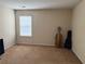 Bedroom featuring neutral walls, carpet floors, and a big window with blinds at 3134 Imperial Sw Cir, Atlanta, GA 30311