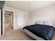 A carpeted bedroom featuring neutral walls, a ceiling light, and interior door, offering a cozy and adaptable space at 1695 Beckworth Ln, Hampton, GA 30228