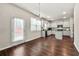 Well-lit kitchen with stainless appliances, center island, and easy access to backyard at 1695 Beckworth Ln, Hampton, GA 30228