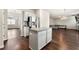 Bright, open kitchen with stainless steel refrigerator and central island at 1695 Beckworth Ln, Hampton, GA 30228