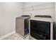 This laundry room features new appliances and shelving at 1695 Beckworth Ln, Hampton, GA 30228