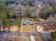 Stunning aerial view of the home, showcasing the surrounding lush trees and neighborhood layout at 2533 Schooner Cv, Snellville, GA 30078