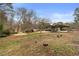 Large backyard with a carport and shed behind the house at 2533 Schooner Cv, Snellville, GA 30078