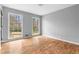 Bedroom with wood flooring and large windows at 2533 Schooner Cv, Snellville, GA 30078