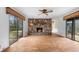 Cozy living room with a stone fireplace and sliding doors allowing for natural light and outdoor access at 2533 Schooner Cv, Snellville, GA 30078