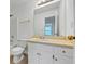 Well-lit bathroom with white cabinets, a mirror, and a bathtub/shower combination at 324 Cheri Pl, Jonesboro, GA 30238