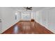 Open-concept living room with hardwood flooring and a view into the white kitchen at 324 Cheri Pl, Jonesboro, GA 30238