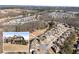 Aerial view of neighborhood featuring craftsman style homes, lush trees, and desirable location at 4445 Trilogy Park Trl, Hoschton, GA 30548