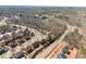 An aerial view showing houses in a community, in a wooded area, that is still under construction at 4445 Trilogy Park Trl, Hoschton, GA 30548