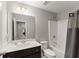 Bathroom featuring a dark vanity and shower with a curtain at 4445 Trilogy Park Trl, Hoschton, GA 30548