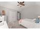 Cozy bedroom features a ceiling fan, closet and desk space at 4445 Trilogy Park Trl, Hoschton, GA 30548