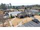 Aerial view of the community center featuring a pool, clubhouse, tennis courts, and parking area at 4445 Trilogy Park Trl, Hoschton, GA 30548