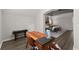 View of a home office with wood floors and a wood desk from the main bedroom at 4445 Trilogy Park Trl, Hoschton, GA 30548