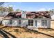 View of the back of the home showing the lawn and multiple windows at 4519 Legend Hollow Ln, Powder Springs, GA 30127