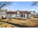 Rear view of home showing large windows and mature trees at 4519 Legend Hollow Ln, Powder Springs, GA 30127