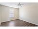 Bedroom with wood look floors and a window providing natural light at 4519 Legend Hollow Ln, Powder Springs, GA 30127