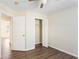 This bedroom features hardwood floors, ceiling fan, closet and neutral paint at 4519 Legend Hollow Ln, Powder Springs, GA 30127