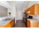 Well-equipped kitchen featuring granite countertops, stainless steel appliances and wood cabinetry at 4519 Legend Hollow Ln, Powder Springs, GA 30127