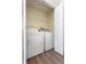 Laundry closet with white washer and dryer, shelf and white bi-fold doors at 4519 Legend Hollow Ln, Powder Springs, GA 30127