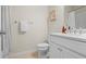 Clean bathroom with a white vanity, granite countertop, and tile flooring at 500 Anfield Dr, Woodstock, GA 30188