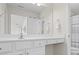 Bright and spacious bathroom with double sinks, white cabinets, and modern fixtures at 500 Anfield Dr, Woodstock, GA 30188