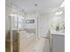 Modern bathroom featuring a separate shower and bathtub with stylish tile and glass enclosure at 500 Anfield Dr, Woodstock, GA 30188