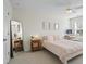 Bright bedroom with a large window, full length mirror, and a work space at 500 Anfield Dr, Woodstock, GA 30188