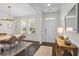 Elegant dining room featuring modern lighting, wainscoting, and a large window at 500 Anfield Dr, Woodstock, GA 30188