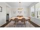 Elegant dining room featuring modern lighting and decor, perfect for Gathering gatherings and dinner parties at 500 Anfield Dr, Woodstock, GA 30188