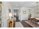 Elegant foyer leading to a dining room and living area, featuring hardwood floors and stylish decor at 500 Anfield Dr, Woodstock, GA 30188