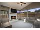 Enclosed porch with ceiling fan, television and fireplace at 500 Anfield Dr, Woodstock, GA 30188