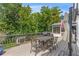 Entertaining back deck with a grill and dining furniture, perfect for outdoor gatherings at 7010 Hunters Knl, Atlanta, GA 30328