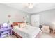 Charming bedroom featuring a plush pink bed frame, a playful vanity, and cozy decor creating a delightful space at 7010 Hunters Knl, Atlanta, GA 30328