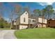 Inviting home exterior with a mix of siding and stone, set on a green lawn under a sunny sky at 2635 Alberta Ln, Marietta, GA 30062