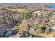 Expansive aerial shot capturing a lakeside community featuring homes, docks and lush greenery at 5065 Sunrise Ln, Cumming, GA 30041