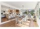 Bright open kitchen with stainless appliances, large island with barstool seating, and adjacent dining area at 5065 Sunrise Ln, Cumming, GA 30041