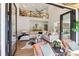 Open-concept living area with soaring ceilings, stylish furnishings, and seamless access to the outdoor space at 5065 Sunrise Ln, Cumming, GA 30041