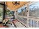 Cozy screened in porch with wood ceiling, and view to lake at 5065 Sunrise Ln, Cumming, GA 30041