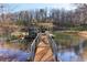 Expansive waterfront property featuring a private dock, boat lift, and direct water access at 5065 Sunrise Ln, Cumming, GA 30041