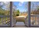 A beautiful backyard view framed by a covered porch, showcasing the yard and charming backyard seating area at 57 Moury Se Ave, Atlanta, GA 30315