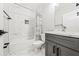 Elegant bathroom featuring marble tile, modern fixtures, and a stylish vanity at 57 Moury Se Ave, Atlanta, GA 30315