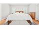 Bright, airy bedroom with hardwood floors and plenty of natural light from the windows at 57 Moury Se Ave, Atlanta, GA 30315