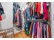 Spacious walk-in closet features wood floors, custom shelving and storage, and decor baskets at 57 Moury Se Ave, Atlanta, GA 30315