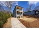 Charming two-story home with a double porch and well-maintained landscaping at 57 Moury Se Ave, Atlanta, GA 30315