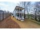 Exterior view of the home showing two-story porches and backyard at 57 Moury Se Ave, Atlanta, GA 30315